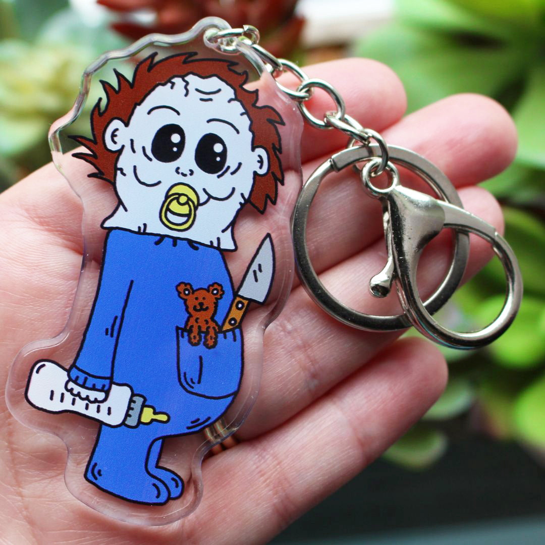 Baby Michael Meyers with his bottle, teddy bear killer, knife and pacifier keychain horror parody by SpookyKillerBabies.com