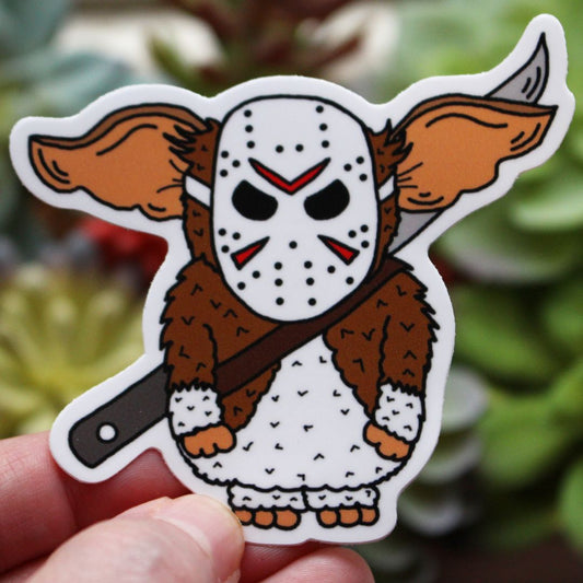 Gremlins Gizmo wearing Jason Voorhees mask sword knife horror parody sticker spooky killer babies picture